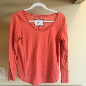 orange long sleeved shirt